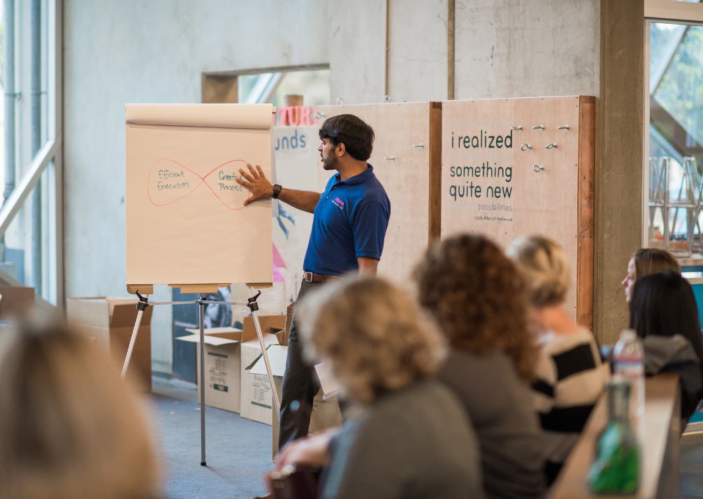 Ziksana founder, Akshay, presenting in front of a crowd